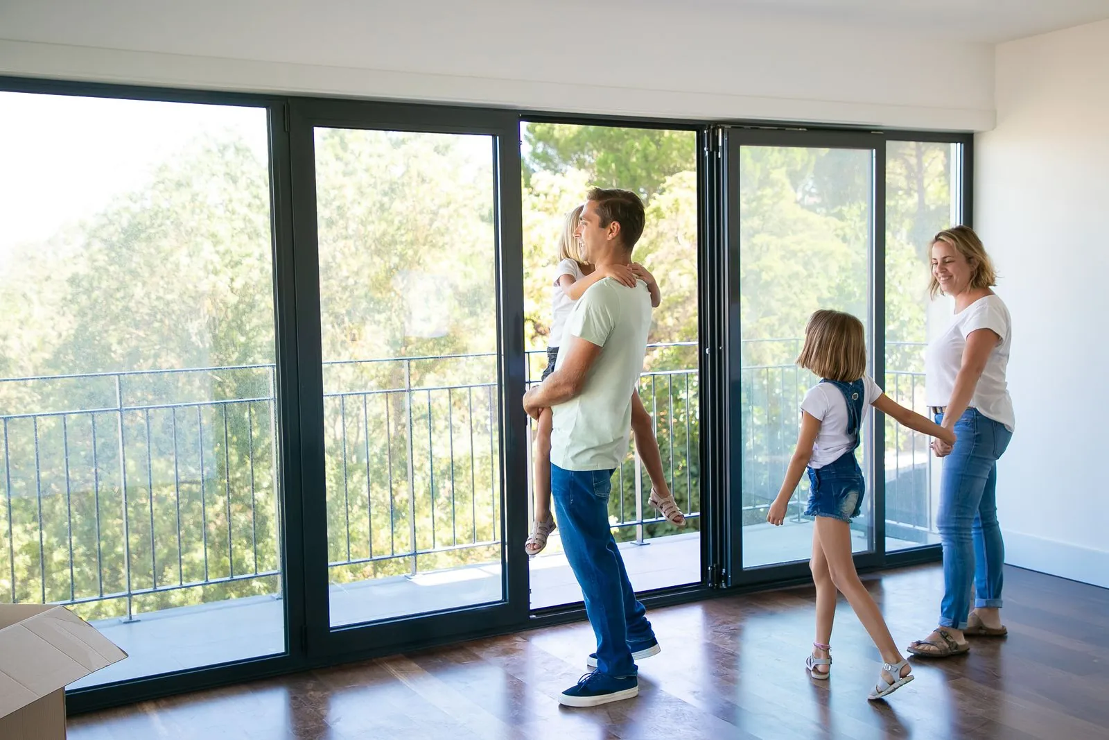 Family by large sliding glass doors